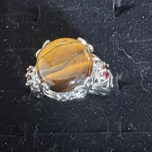 Elegant Silver and Gold Ring with Red Accents